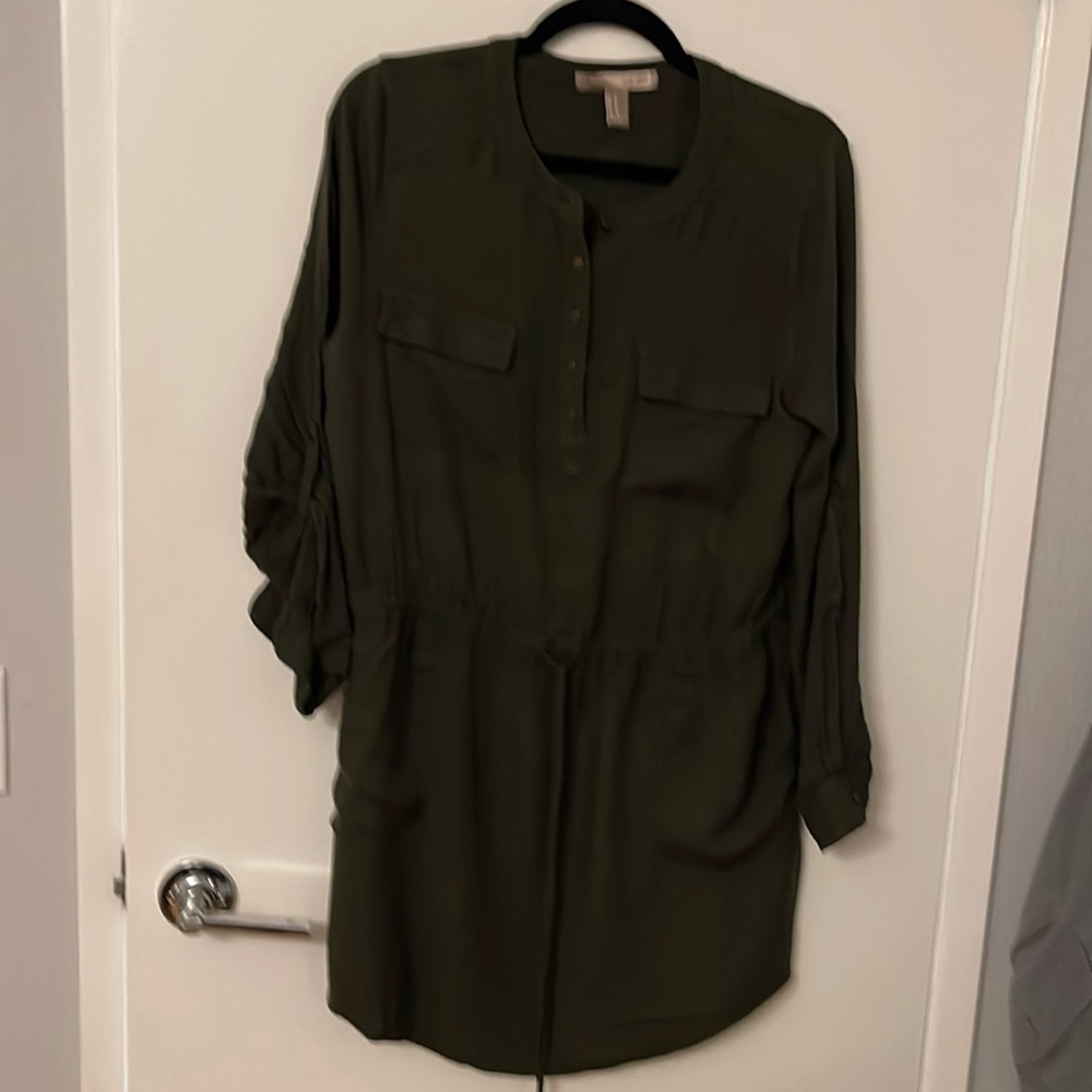 A short dress dark green 4 pockets long sleeve and option of folding the sleeve.